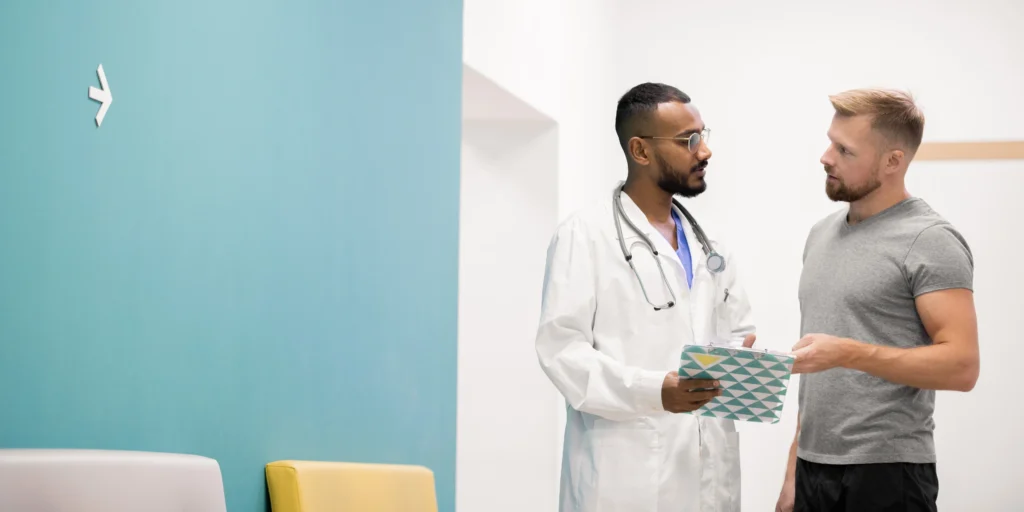 Doctor talking with patient